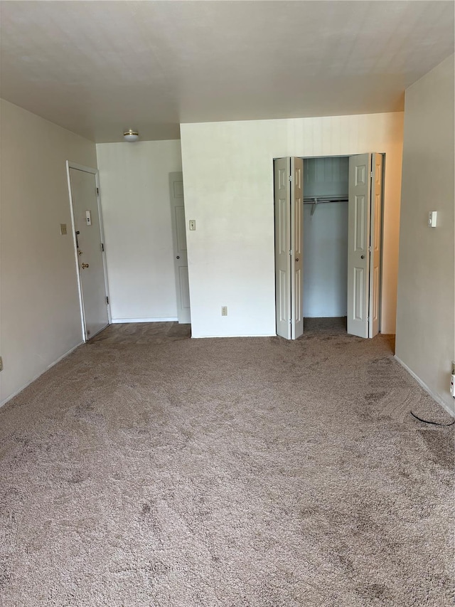 unfurnished room with carpet floors