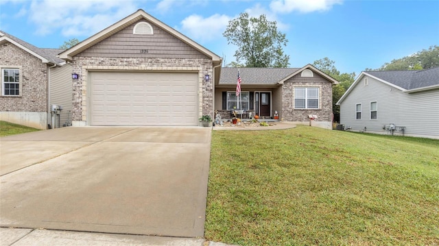 ranch-style home with a garage, brick siding, driveway, and a front yard