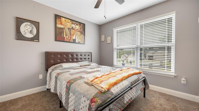 bedroom with a ceiling fan, carpet flooring, and baseboards