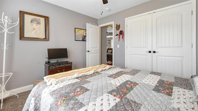 bedroom featuring a ceiling fan, carpet flooring, baseboards, and a closet