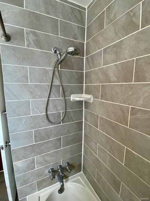 bathroom featuring washtub / shower combination