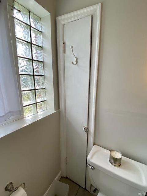 bathroom featuring tile patterned floors and toilet