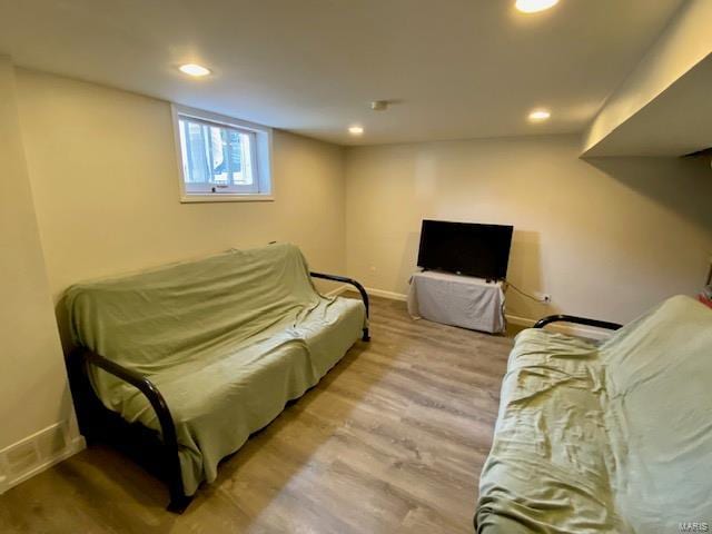 living area with wood finished floors, recessed lighting, and baseboards