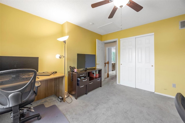 home office with a ceiling fan, carpet flooring, baseboards, and visible vents