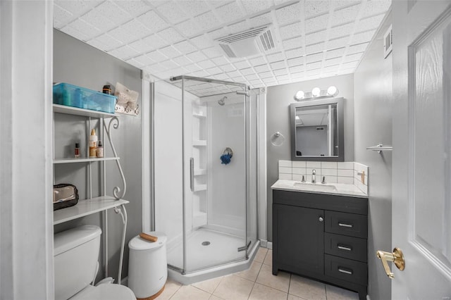 full bath featuring toilet, visible vents, a shower stall, and tile patterned flooring
