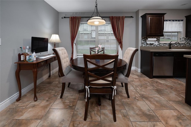 dining area featuring a wealth of natural light and baseboards