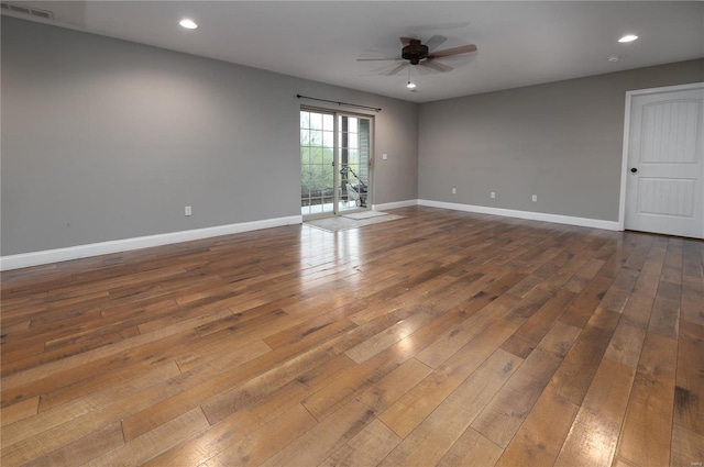 unfurnished room with recessed lighting, ceiling fan, dark wood-style flooring, baseboards, and visible vents