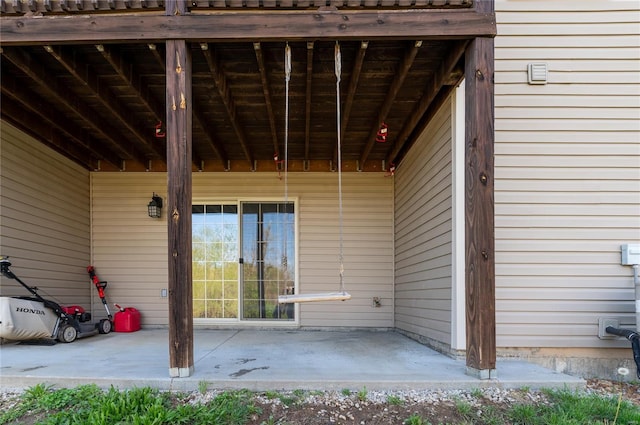 entrance to property with a patio