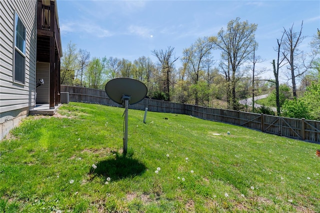 view of yard with a fenced backyard