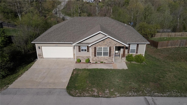 view of front of home featuring a front lawn, a garage, driveway, stone siding, and roof with shingles