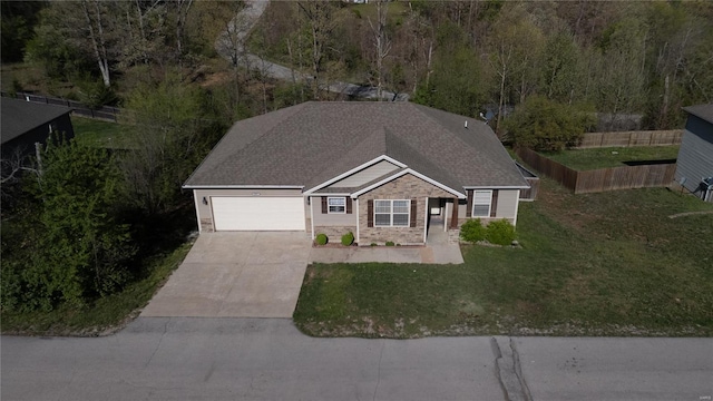 single story home featuring a front lawn, a garage, stone siding, concrete driveway, and fence