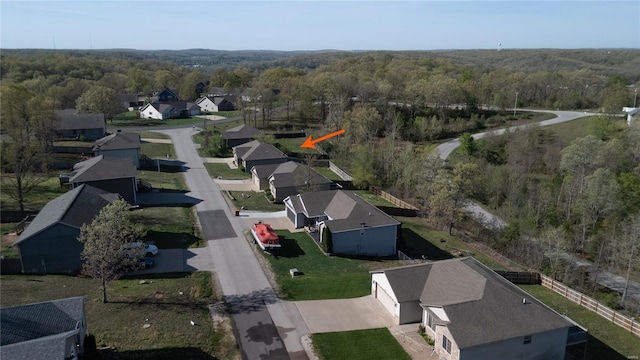 aerial view featuring a residential view and a view of trees