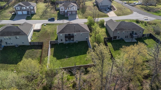 birds eye view of property with a residential view