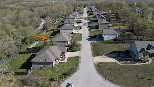 birds eye view of property with a residential view and a forest view