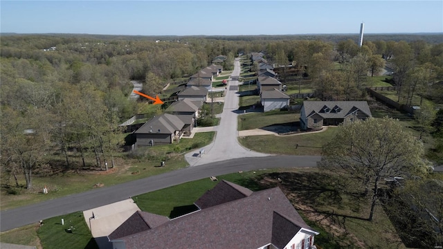aerial view featuring a residential view and a forest view