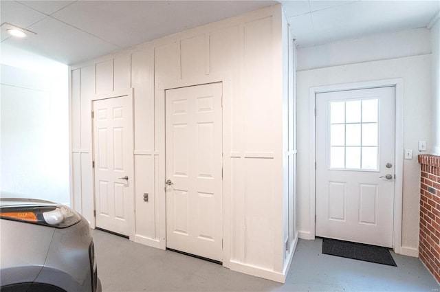doorway to outside featuring finished concrete floors