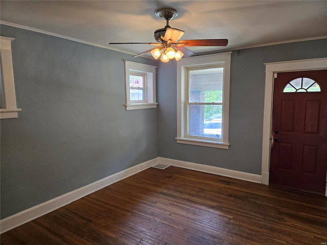 entryway with baseboards, ceiling fan, dark wood-style floors, visible vents, and crown molding