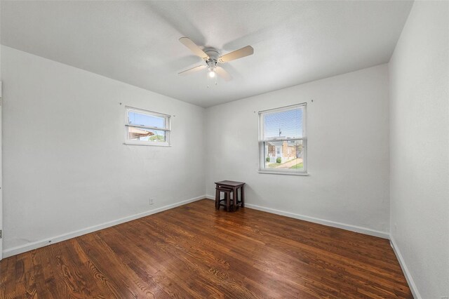 unfurnished room featuring baseboards, a ceiling fan, and wood finished floors