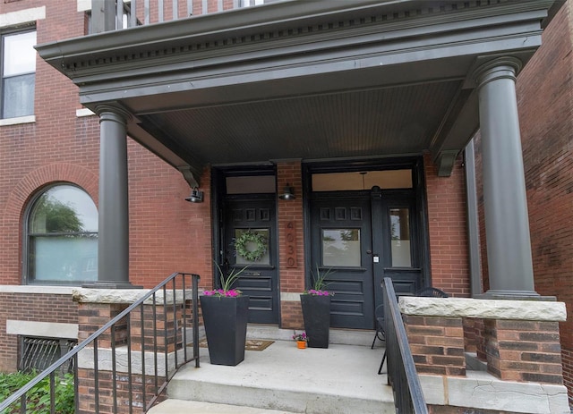 entrance to property with brick siding
