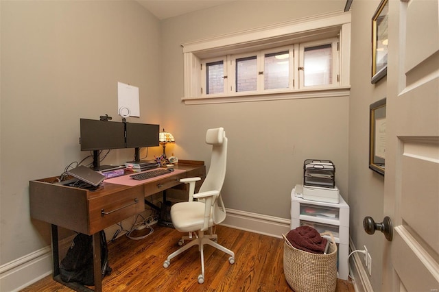 office featuring baseboards and wood finished floors