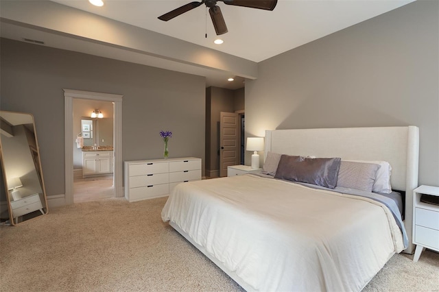 bedroom featuring light carpet, baseboards, recessed lighting, connected bathroom, and a ceiling fan
