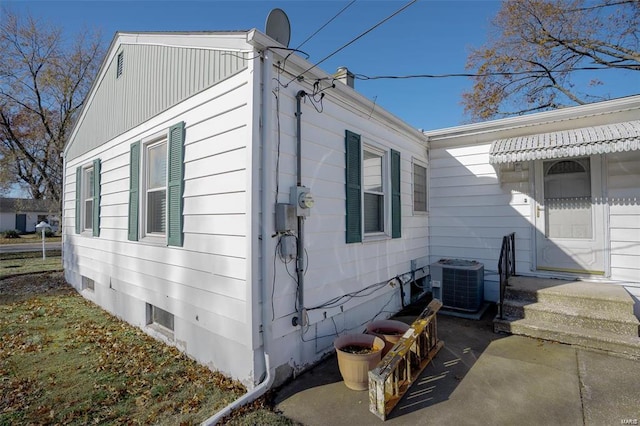 view of side of home featuring central air condition unit