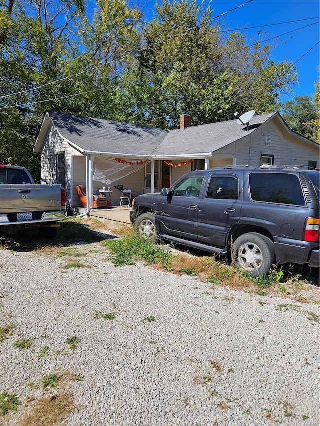 view of car parking featuring gravel driveway