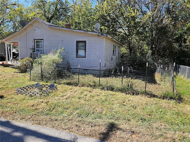 view of side of home featuring fence, cooling unit, a chimney, crawl space, and a lawn