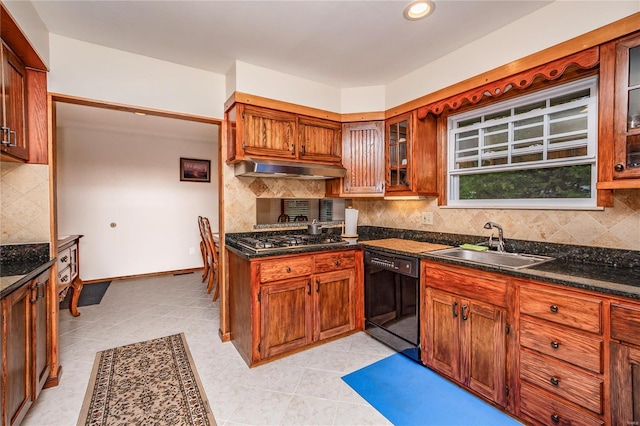 kitchen with a sink, dishwasher, decorative backsplash, stainless steel gas stovetop, and under cabinet range hood