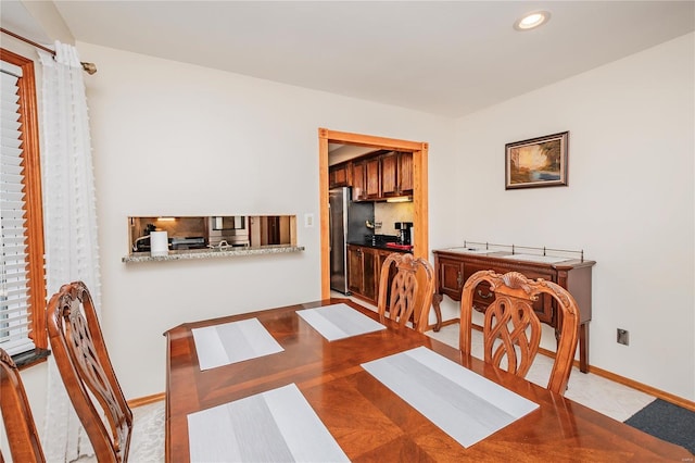 dining area with baseboards and recessed lighting