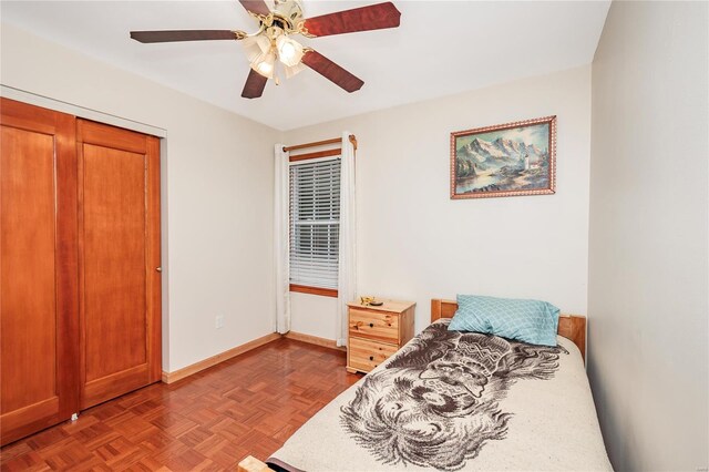 bedroom featuring baseboards and a ceiling fan
