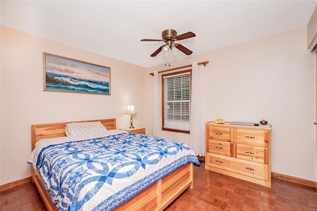 bedroom with baseboards and ceiling fan