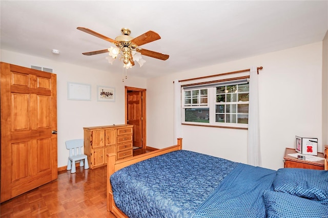 bedroom featuring visible vents and ceiling fan