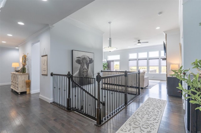 hallway featuring crown molding, recessed lighting, an upstairs landing, and baseboards