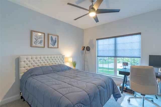 bedroom with baseboards, a ceiling fan, and carpet floors