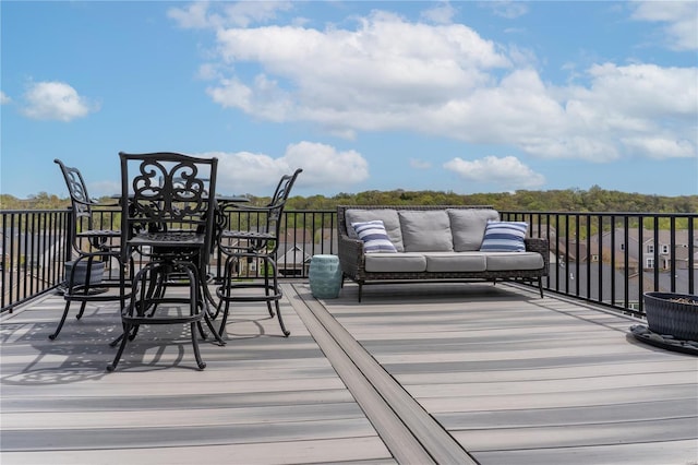 wooden deck with an outdoor hangout area