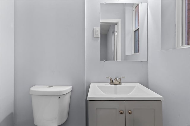 bathroom with toilet and vanity