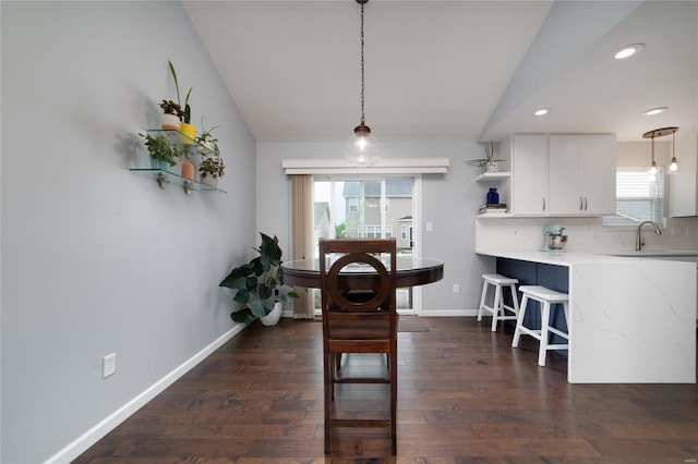 dining space featuring recessed lighting, baseboards, vaulted ceiling, and dark wood-style floors
