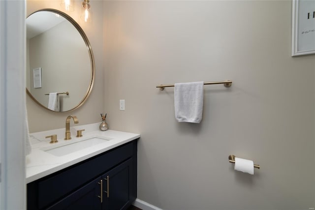 bathroom featuring baseboards and vanity