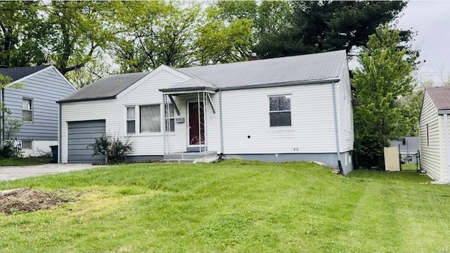 ranch-style house featuring a garage, driveway, a front yard, and a shingled roof