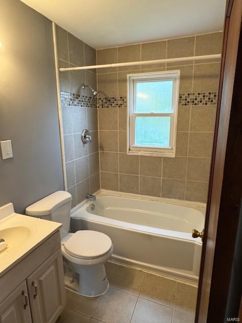 full bath with tile patterned flooring, tub / shower combination, toilet, and vanity