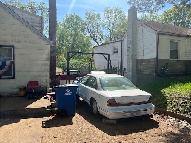 view of side of property with a chimney
