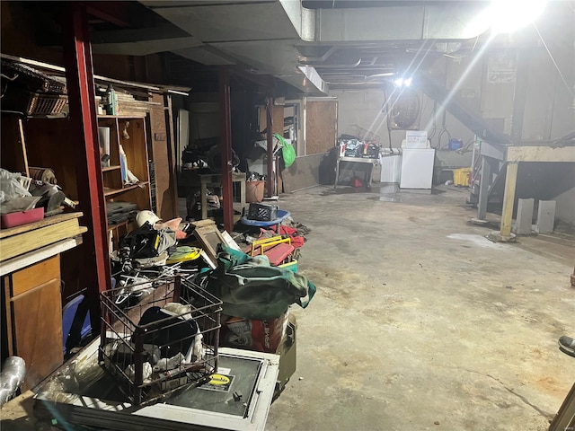 unfinished basement featuring washer / clothes dryer