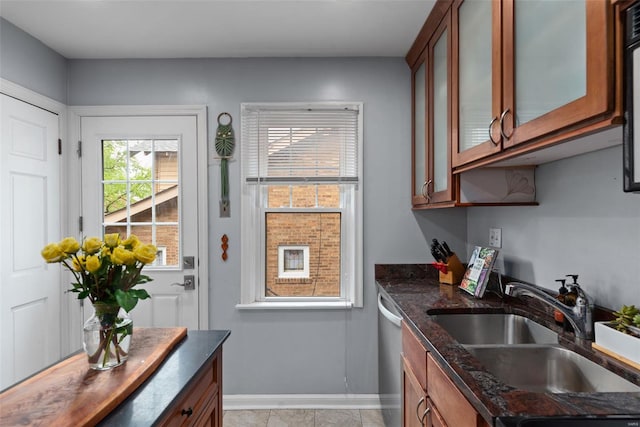 interior space with baseboards and a sink