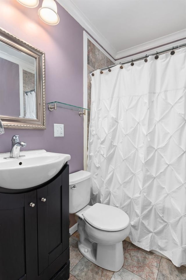 bathroom featuring toilet, ornamental molding, curtained shower, and vanity
