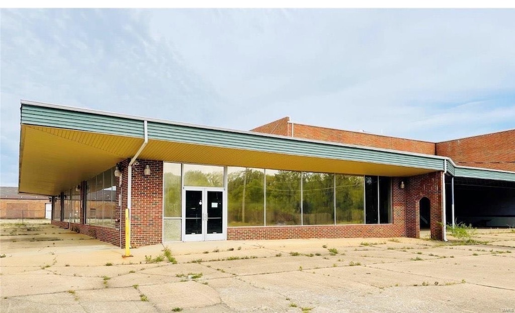 exterior space with brick siding