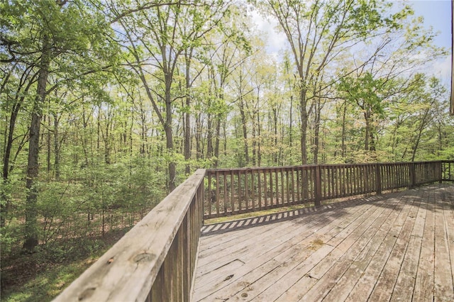deck featuring a wooded view