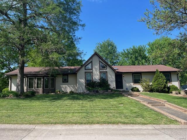 ranch-style house with a front lawn