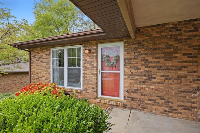 entrance to property with brick siding