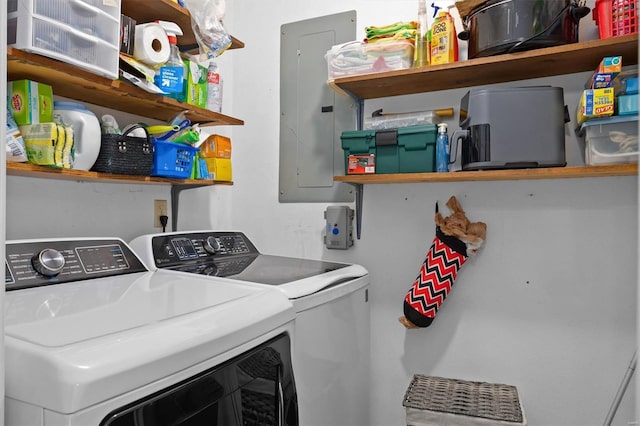 laundry room with separate washer and dryer, electric panel, and laundry area